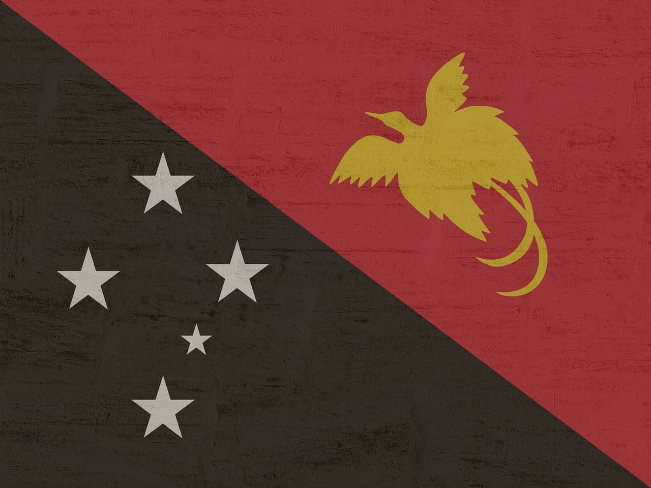 Bandera desplegada al aire libre, en el chat de Nueva Guinea